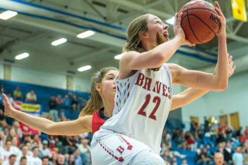 Chris Detrick  |  The Salt Lake Tribune
Bountiful's Mary Larson (22) shoots past Springville's Savannah Sumsion (10) during the 4A girls' basketball championships at Salt Lake Community College Saturday February 27, 2016. Bountiful defeated Springville 63-42.