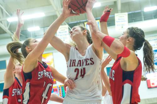 Chris Detrick  |  The Salt Lake Tribune
Bountiful's Kennedy Redding (24) shoots past Springville's Savannah Sumsion (10) and Springville's Olivia Park (3) during the 4A girls' basketball championships at Salt Lake Community College Saturday February 27, 2016. Bountiful defeated Springville 63-42.