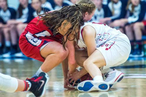 Chris Detrick  |  The Salt Lake Tribune
Springville's Ali Monson (11) and Bountiful's Kieran Gillins (10) go for the ball during the 4A girls' basketball championships at Salt Lake Community College Saturday February 27, 2016.