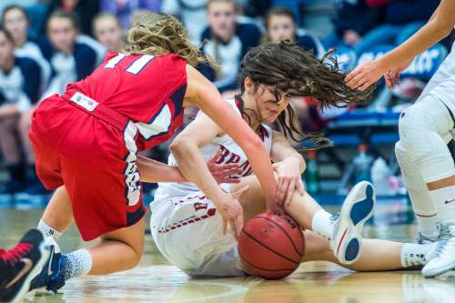 Chris Detrick  |  The Salt Lake Tribune
Springville's Ali Monson (11) and Bountiful's Kieran Gillins (10) go for the ball during the 4A girls' basketball championships at Salt Lake Community College Saturday February 27, 2016.