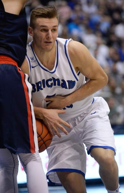 Francisco Kjolseth | The Salt Lake Tribune
Brigham Young Cougars guard Kyle Collinsworth (5) loses the ball as he runs into the Gonzaga defense in game action at the Marriott Center, Provo, UT.