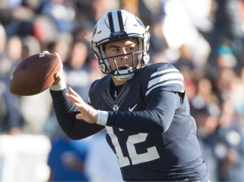 Rick Egan  |  The Salt Lake Tribune

Brigham Young Cougars quarterback Tanner Mangum (12) throws down field, in football action, as BYU defeated the Fresno Bulldogs 52 -10, at Lavell Edwards stadium, Tuesday, November 21, 2015.