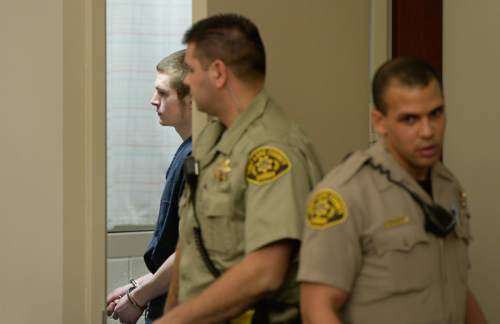 Francisco Kjolseth | The Salt Lake Tribune
Darwin Christopher Bagshaw, 18, gets ready to appear at the Matheson courthouse in Salt Lake City for a change of plea hearing on Monday, Feb. 29, 2016. Bagshaw is charged with one count of first-degree felony murder for the 2012 death of Anne Kasprzak. Bagshaw, who was 14 at the time of the homicide, pleaded not guilty to the crime last year and a three-week trial had been set to begin March 7, nearly four years to the day after Kasprzak was beaten to death and her body dropped in the Jordan River.