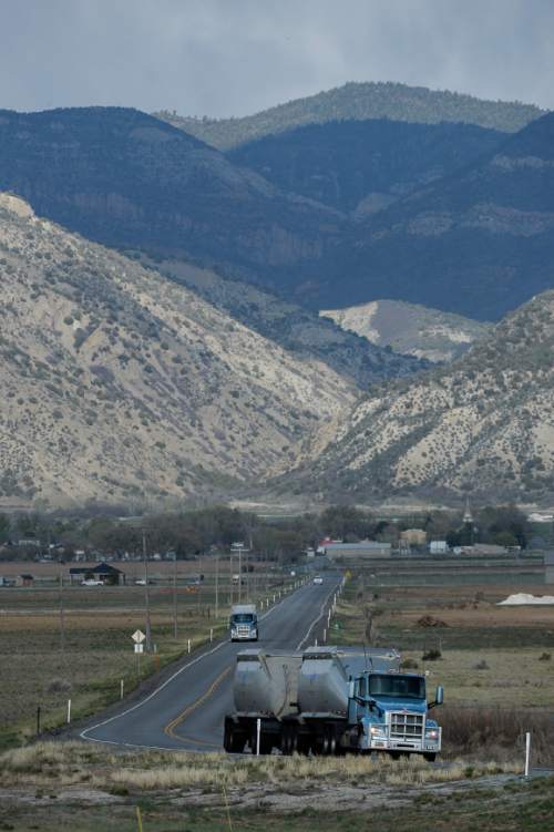 Francisco Kjolseth  |  The Salt Lake Tribune 
Coal trucked from central Utah piles up at the Levan transfer station south of Nephi, where it is loaded on Union Pacific freight cars bound for California. Utah's Community Impact Board has awarded a $53 million loan to four coal-producing counties to invest in a deep-water port in Oakland, Calif. hoping to connect central Utah commodities with export markets. Bowie Resource Partners already exports about 1 to 3 million tons of coal from its Utah mines.