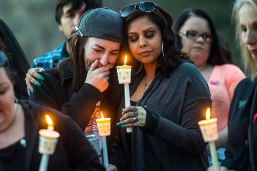 Chris Detrick  |  The Salt Lake Tribune
Vanessa Tudor, right, hugs Whitney Bodell during a vigil for Hope Gabaldon at Liberty Park Sunday February 28, 2016. Gabaldon, 21, was found mortally wounded in the city on Thursday night. West Valley City police, working with law enforcement in Denver, found and detained a person of interest Sunday afternoon, according to a news release.