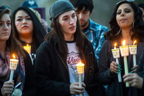 Chris Detrick  |  The Salt Lake Tribune
Whitney Bodell holds a candle during a vigil for her girlfriend Hope Gabaldon at Liberty Park Sunday February 28, 2016. Gabaldon, 21, was found mortally wounded in the city on Thursday night. West Valley City police, working with law enforcement in Denver, found and detained a person of interest Sunday afternoon, according to a news release.