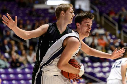 Trent Nelson  |  The Salt Lake Tribune
Corner Canyon's Brayden Johnson (13) pulls down a rebound, ahead of Payson's Kolten Mortensen (32) as Payson faces Corner Canyon in a first round game at the 4A state high school basketball tournament at the Dee Events Center in Ogden, Monday February 29, 2016.