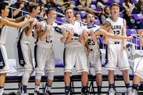 Trent Nelson  |  The Salt Lake Tribune
Corner Canyon players hold up Corner Canyon's Hayden Borg (10) to celebrate a three-pointer by Corner Canyon's Brayden Johnson (13) as Payson faces Corner Canyon in a first round game at the 4A state high school basketball tournament at the Dee Events Center in Ogden, Monday February 29, 2016.