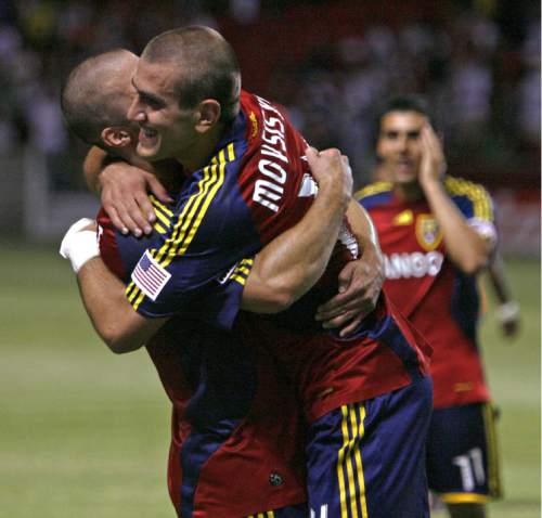 Real Salt Lake's Yura Movsisyan, right, celebrates with Chris Wingert after making two goals against FC Dallas at Rio Tinto Stadium on Friday, July 24, 2009. (AP photo/Stephen Holt - Salt Lake Tribune) -UTSAL, Deseret News Out, Local TV Out, Mags Out