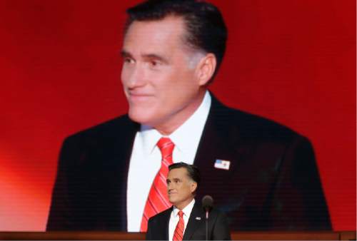 Republican presidential nominee Mitt Romney acknowledges delegates before speaking at the Republican National Convention in Tampa, Fla., on Thursday, Aug. 30, 2012.  (AP Photo/Charles Dharapak)