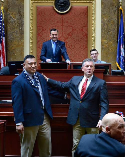 Scott Sommerdorf   |  The Salt Lake Tribune  
BYU head football coach Kelani Sitake, left, and Utah head coach Kyle Whittingham are honored by being introduced in the Utah House of Representatives, Thursday, March 3, 2016. Speaker of the House Greg Hughes, R-Draper is in the background.