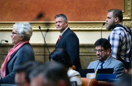 Scott Sommerdorf   |  The Salt Lake Tribune  
Utah head football coach Kyle Whittingham arrives in the Utah House of Representatives, just as Rep. Carol Spackman-Moss, D-Salt Lake, left, is presenting her bill, HB221 - Immunization of Students Amendments, Thursday, March 3, 2016. The arrival of Whittingham and BYU coach Kelani Sitake on the House floor caused quite a distraction as she was trying to make a case for her bill, which was eventually circled to give her a chance to revisit it at a later time.