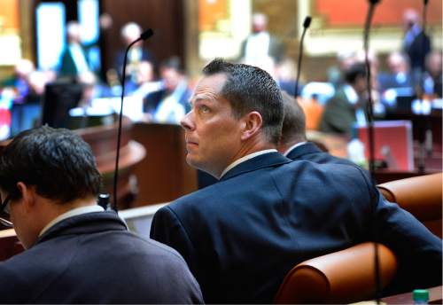 Scott Sommerdorf   |  The Salt Lake Tribune  
Rep. Jacob Anderegg, R-Lehi, glances at the voting board as he looks at the progress of his motion to apply an eighth amendment to the bill Rep. Carol Spackman-Moss, D-Salt Lake, was introducing - HB221 - Immunization of Students Amendments - in the Utah House of Representatives, Thursday, March 3, 2016. The bill was eventually circled to give the sponsor time to deal with the hostile amendments. An added difficulty for Spackman-Moss was having to present her bill in the midst of the hubbub caused when the BYU and Utah football coaches visited the floor as she was presenting.
