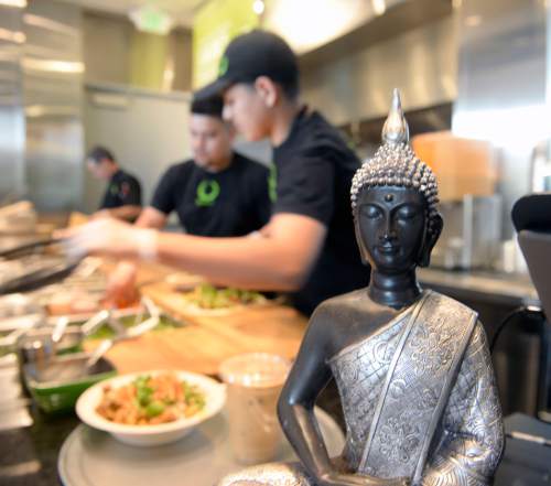 Al Hartmann  |  The Salt Lake Tribune
Fresh food is prepared in front of you at Zao Asian Cafe, a quick-serve restaurant that serves Asian-inspired sandwiches, tacos, rice bowls and noodle bowls.