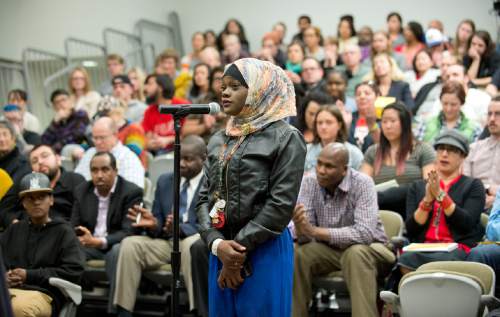 Lennie Mahler  |  The Salt Lake Tribune

Muslima Aden, cousin of Abdi Mohamed, asks questions of the Salt Lake City Human Rights Commission and city officials Wednesday during a "listening session" held at the Marmalade library.