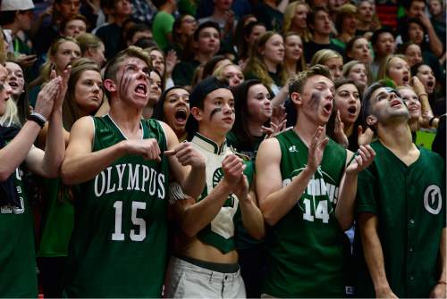Scott Sommerdorf   |  The Salt Lake Tribune  
Olympus fans have fun with the rout against Woods Cross. Olympus beat Woods Cross 70-42 in a 4A semi-final played at the University of Utah, Friday, March 4, 2016.