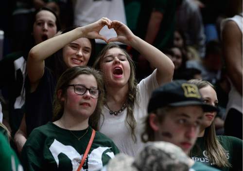 Scott Sommerdorf   |  The Salt Lake Tribune  
Olympus fans react to players on the court during second half play. Olympus beat Woods Cross 70-42 in a 4A semi-final played at the University of Utah, Friday, March 4, 2016.