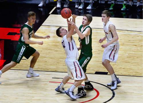 Scott Sommerdorf   |  The Salt Lake Tribune  
Jacob Tribe of Woods Cross and Isaac Monson battle for a rebound during first half play. Olympus beat Woods Cross 70-42 in a 4A semi-final played at the University of Utah, Friday, March 4, 2016.