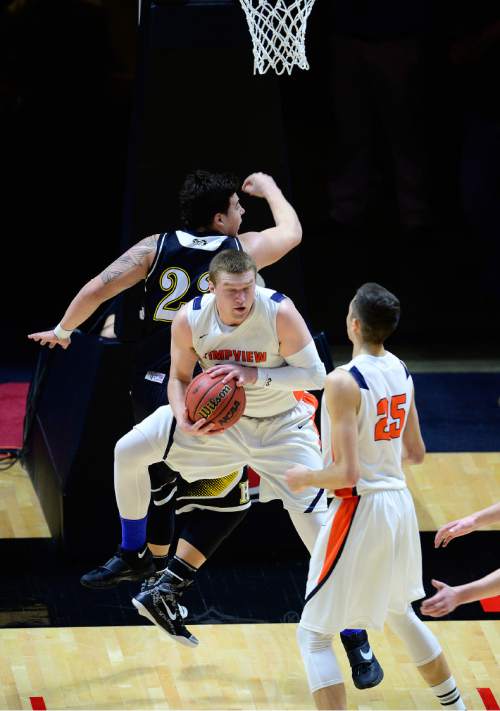 Scott Sommerdorf   |  The Salt Lake Tribune  
Timpview center AJ Bollinger rips down this rebound during second half play. Timpview beat Highland 59-49 in a 4A semi-final played at the University of Utah, Friday, March 4, 2016.