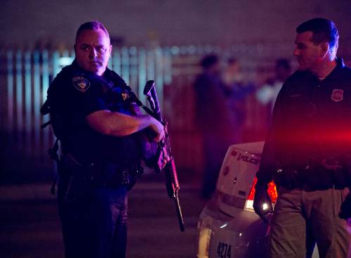 Lennie Mahler  |  Tribune file photo

A University of Utah police officer pulls his assault rifle out of the trunk in response to an angry crowd that formed after an officer-involved shooting at 200 South Rio Grande Street in Salt Lake City, Saturday, Feb. 27, 2016.