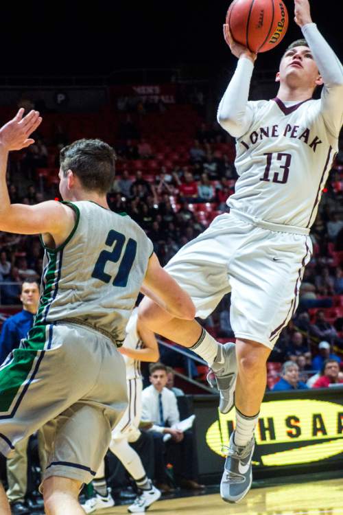Chris Detrick  |  The Salt Lake Tribune
Lone Peak's Blake Cannon (13) shoots over Copper Hills' Charles Olsen (21) during the 5A boy's basketball tournament at the Huntsman Center at the University of Utah Thursday March 3, 2016. Copper Hills is winning the game 33-22 at halftime.