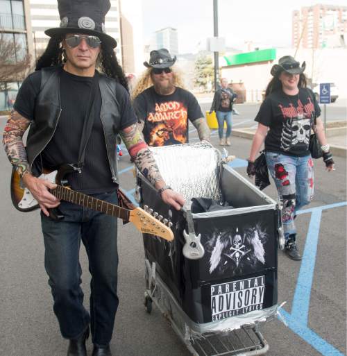 Rick Egan  |  The Salt Lake Tribune

The "Heavy Metal" team heads down 600 South, in the 9th Annual Urban Chariot Race, Saturday, March 5, 2016.