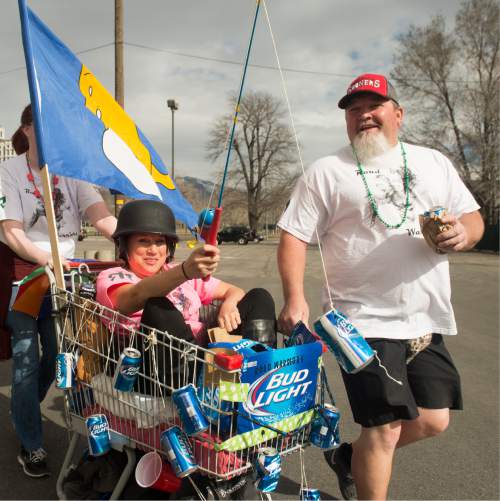 Rick Egan  |  The Salt Lake Tribune

Tawny Dulen rides in the cart with the "Road Warriors" team, in the 9th Annual Urban Chariot Race, Saturday, March 5, 2016.