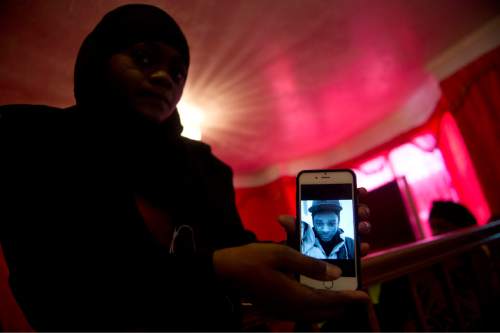 Lennie Mahler  |  The Salt Lake Tribune

Muslima Aden shows a photo of her cousin, Abdi Mohamed, from her phone Friday, March 4, 2016.