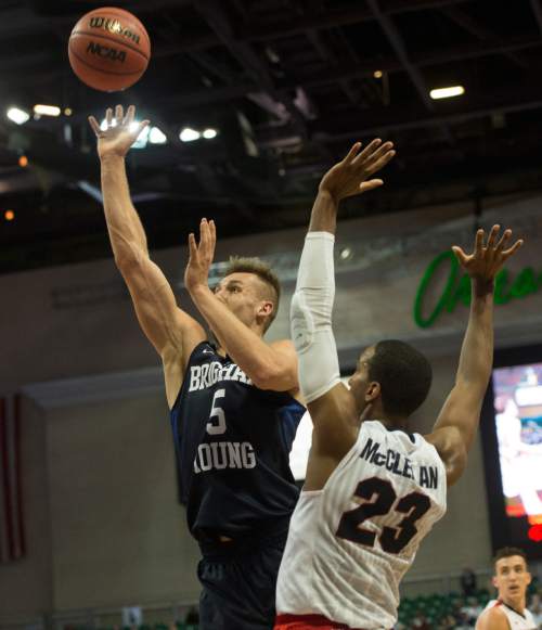Rick Egan  |  The Salt Lake Tribune

Brigham Young Cougars guard Kyle Collinsworth (5) scores, as he gets past defender, Gonzaga Bulldogs guard Eric McClellan (23) in the West Coast Conference Semifinals, at the Orleans Arena in Las Vegas, Saturday, March 7, 2016.