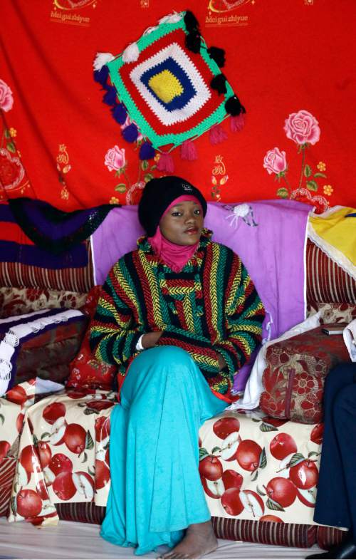 Abdi Mohamed's cousin Muslima Aden talks during a interview Thursday, March 3, 2016, Salt Lake City. Mohamed, a 17-year-old Somali refugee critically wounded in a high-profile police shooting in Utah fled to the U.S. from a refugee camp where food was scare, scorpions scurried everywhere and a toilet was a hole in the ground. Mohamed's family settled in Salt Lake City, hoping for a better life. (AP Photo/Rick Bowmer)