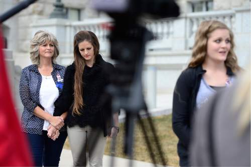 Scott Sommerdorf   |  The Salt Lake Tribune  
LaVoy Finicum's family, widow Jeanette, far left, daughter Thara Tenney, and Brittney Beck at far right speaking to the media as they held a rally at the Utah State Capitol, Saturday, March 5, 2016.
