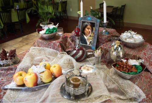 Steve Griffin  |  The Salt Lake Tribune


Nasrin Mohammadi, owner of Pars Market in Salt Lake City, is reflected in a mirror that is part of a traditional table setting for the Persian New Year, called Norouz, which takes place on the Spring Equinox.