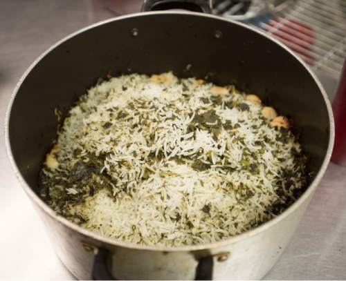 Steve Griffin  |  The Salt Lake Tribune


The traditional meal for Persian New Year include long-grain basmati rice cooked with cilantro, parsley, leeks and other fresh herbs. It is served with fish.