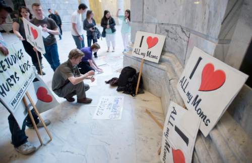 Steve Griffin  |  The Salt Lake Tribune
People make signs as they attend a protest rally against H.B. 281 that if passed make polygamy a felony in Utah again. Members of Utah's plural marriage community are not happy and rallied against the bill in the Capitol Rotunda during the 2016 legislative session in Salt Lake City on Monday.
