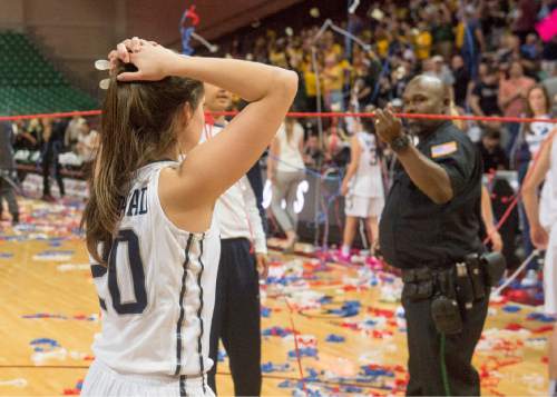 Rick Egan  |  The Salt Lake Tribune

Brigham Young Cougars guard Cassie Broadhead (20) leaves the court, as San Francisco Lady Dons celebrates their 70-68 upset of the Cougars, in the West Coast Conference Championship game, at the Orleans Arena in Las Vegas, Tuesday, March 8, 2016.