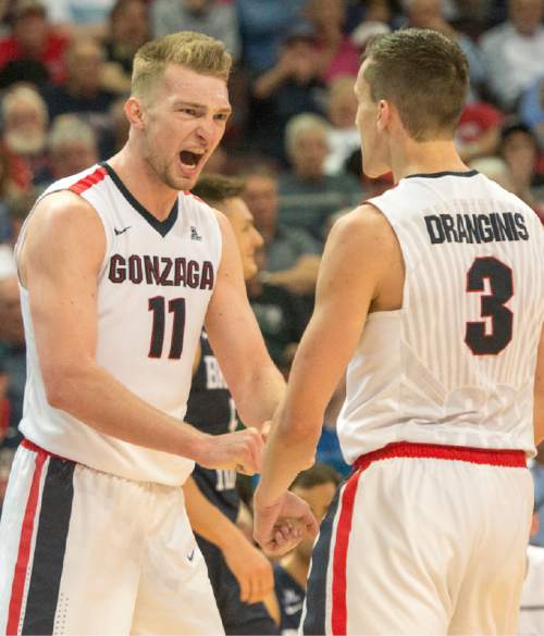 Rick Egan  |  The Salt Lake Tribune

Gonzaga Bulldogs forward Domantas Sabonis (11) and Gonzaga Bulldogs guard Kyle Dranginis (3) celebrate as the call by the official goes their way near the end of the game, in the West Coast Conference Semifinals, at the Orleans Arena in Las Vegas, Saturday, March 7, 2016.