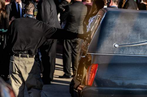 Trent Nelson  |  The Salt Lake Tribune
A man openly carrying two handguns pays his respect to the hearse, at the funeral for Robert "LaVoy" Finicum, in Kanab, Friday February 5, 2016. Finicum was shot and killed by police during a January 26 traffic stop. Finicum was part of the armed occupation of an Oregon wildlife refuge.
