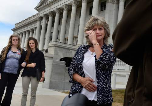 Scott Sommerdorf   |  The Salt Lake Tribune  
LaVoy Finicum's widow, Jeanette wipes away a tear as she talks about what she called her husband's "assasination" while speaking to the media prior to a rally at the Utah State Capitol, Saturday, March 5, 2016.