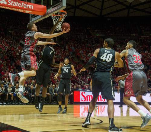Rick Egan  |  The Salt Lake Tribune

Utah Utes guard Isaiah Wright (1) defends as Utes forward Jakob Poeltl (42)goes underneath for a shot, in Pac-12 basketball action at the Huntsman Center Saturday, March 5, 2016.