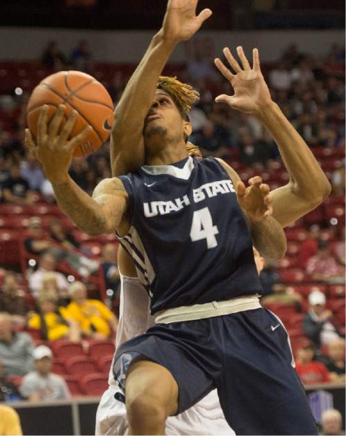 Rick Egan  |  The Salt Lake Tribune

Utah State Aggies guard Shane Rector (4) goes to the hoop, in the Mountain West Conference playoff action, at the Thomas & Mack Center, in Las Vegas, Wednesday, March 8, 2016.
