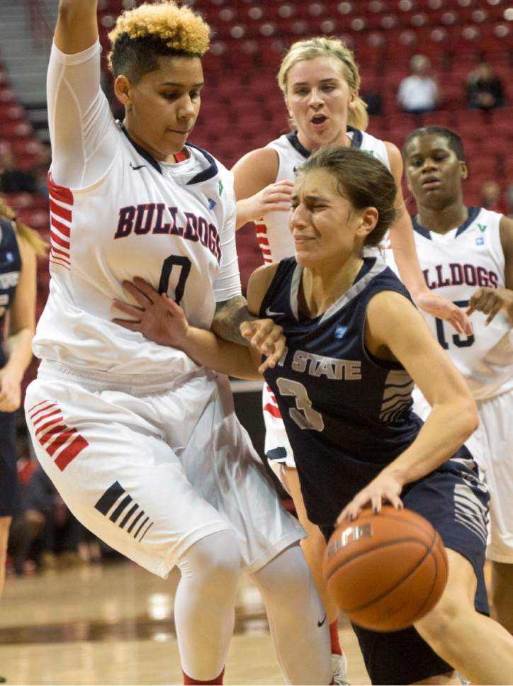 Rick Egan  |  The Salt Lake Tribune

Utah State Aggies guard/forward Funda Nakkasoglu (3) tries to make her way past Fresno State Bulldogs guard Moriah Faulk (0), in the Mountain West Conference playoff action, The Utah State Aggies vs. The Fresno State Bulldogs, at the Thomas & Mack Center, in Las Vegas, Tuesday, March 8, 2016.