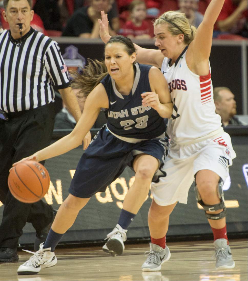 Rick Egan  |  The Salt Lake Tribune

Utah State Aggies guard Baylee Peck (23) tries to get the ball down court, as Fresno State Bulldogs guard Alex Furr (11) puts on the full court press, in Mountain West Conference playoff action, The Utah State Aggies vs. The Fresno State Bulldogs, at the Thomas & Mack Center, in Las Vegas, Tuesday, March 8, 2016.