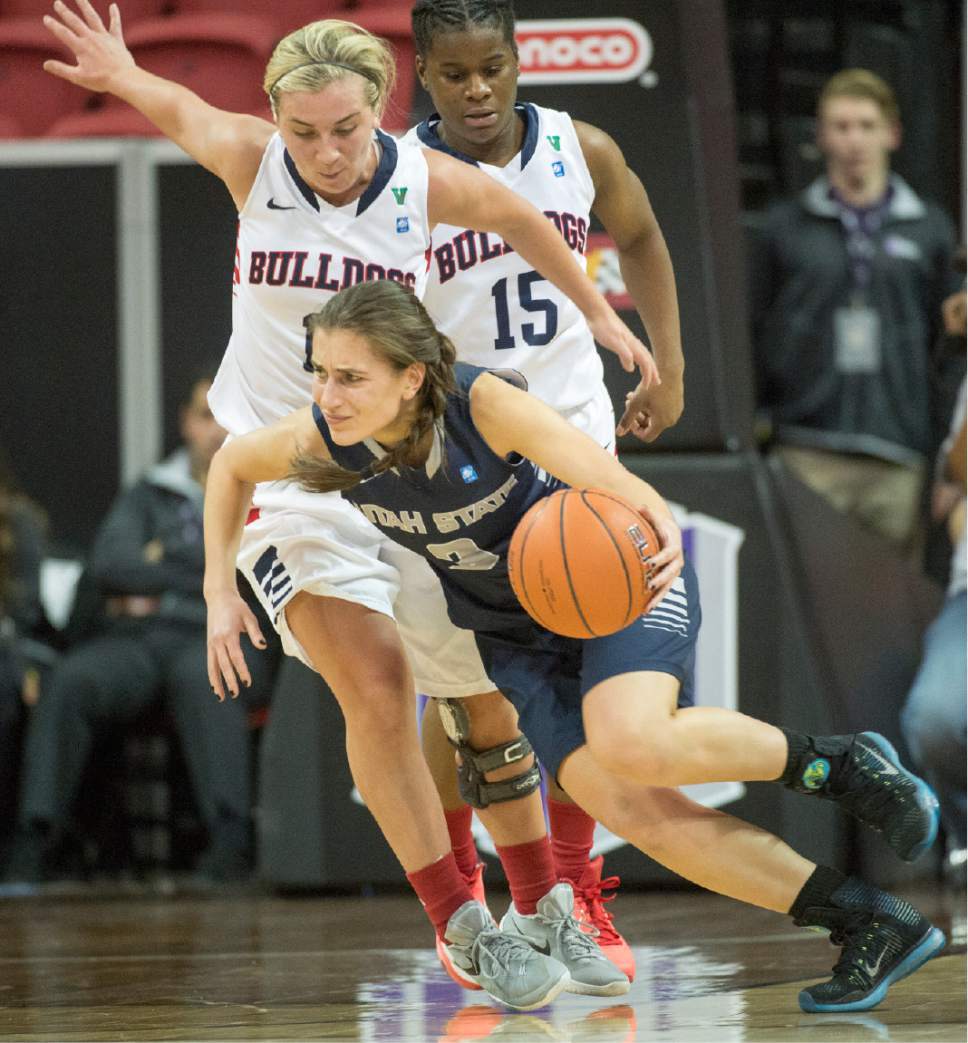 Rick Egan  |  The Salt Lake Tribune

Utah State Aggies guard/forward Funda Nakkasoglu (3) tries to get past Fresno State Bulldogs guard Alex Furr (11), in Mountain West Conference playoff action, The Utah State Aggies vs. The Fresno State Bulldogs, at the Thomas & Mack Center, in Las Vegas, Tuesday, March 8, 2016.