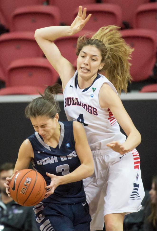 Rick Egan  |  The Salt Lake Tribune

Fresno State Bulldogs center Bego Faz Davalos (4) collides with Utah State Aggies guard/forward Funda Nakkasoglu (3). in Mountain West Conference playoff action, The Utah State Aggies vs. The Fresno State Bulldogs, at the Thomas & Mack Center, in Las Vegas, Tuesday, March 8, 2016.