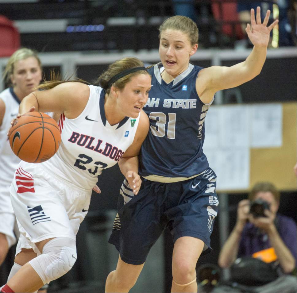 Rick Egan  |  The Salt Lake Tribune

Fresno State Bulldogs guard Breanne Knishka (23) dribbles the ball, as Utah State Aggies guard Katie Toole (31) defends, in Mountain West Conference playoff action, The Utah State Aggies vs. The Fresno State Bulldogs, at the Thomas & Mack Center, in Las Vegas, Tuesday, March 8, 2016.