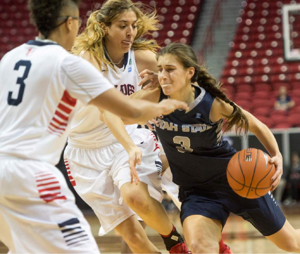 Rick Egan  |  The Salt Lake Tribune

Utah State Aggies guard/forward Funda Nakkasoglu (3) tries to get past Fresno State Bulldogs guard Brittany Aikens (3) and Fresno State Bulldogs center Bego Faz Davalos (4), in Mountain West Conference playoff action, The Utah State Aggies vs. The Fresno State Bulldogs, at the Thomas & Mack Center, in Las Vegas, Tuesday, March 8, 2016.