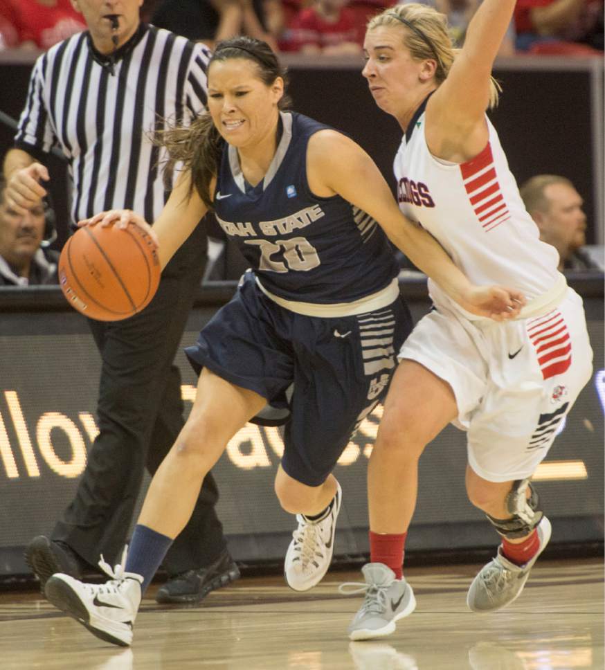 Rick Egan  |  The Salt Lake Tribune

Utah State Aggies guard Baylee Peck (23) tries to get the ball down court, as Fresno State Bulldogs guard Alex Furr (11) puts on the full court press, in Mountain West Conference playoff action, The Utah State Aggies vs. The Fresno State Bulldogs, at the Thomas & Mack Center, in Las Vegas, Tuesday, March 8, 2016.