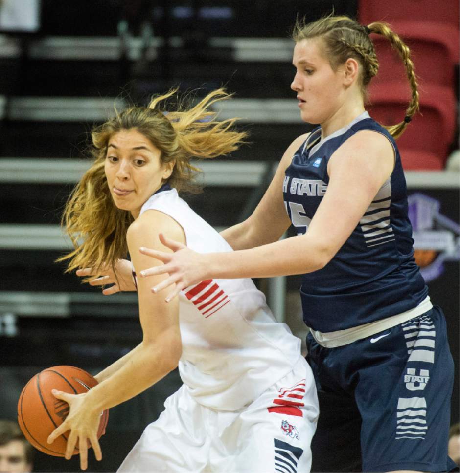 Rick Egan  |  The Salt Lake Tribune

Utah State Aggies center Hannah Hutchins (15) guards Fresno State Bulldogs center Bego Faz Davalos (4), in Mountain West Conference playoff action, The Utah State Aggies vs. The Fresno State Bulldogs, at the Thomas & Mack Center, in Las Vegas, Tuesday, March 8, 2016.