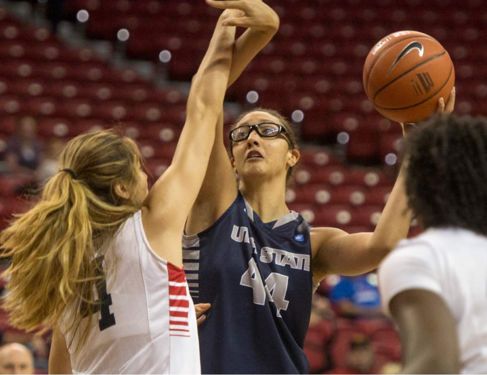 Rick Egan  |  The Salt Lake Tribune

Utah State center Deja Mason (44) takes a shot for the Aggies, as Fresno State Bulldogs center Bego Faz Davalos (4) defends, in the Mountain West Conference playoff action, The Utah State Aggies vs. The Fresno State Bulldogs, at the Thomas & Mack Center, in Las Vegas, Tuesday, March 8, 2016.