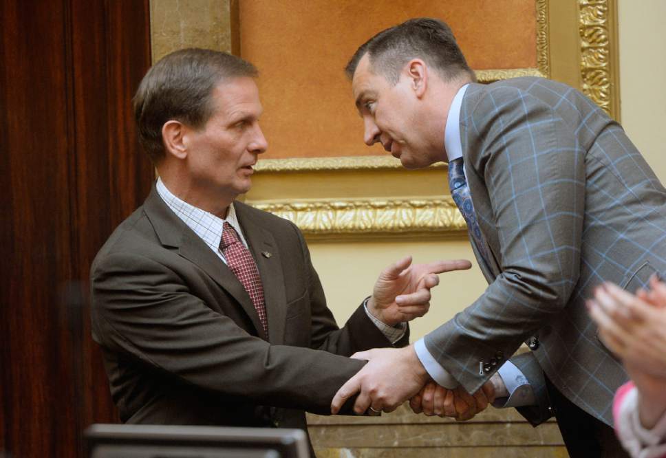 Al Hartmann  |  The Salt Lake Tribune
Utah Congressman Chris Stewart, left, shakes hands with Speaker of the House Greg Hughes after he spoke before the Utah House of Representatives Thursday Jan 28.